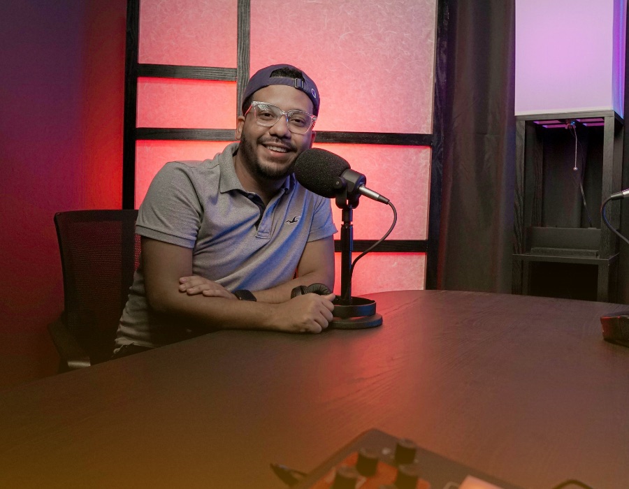 Podcast host at the microphone in our studio