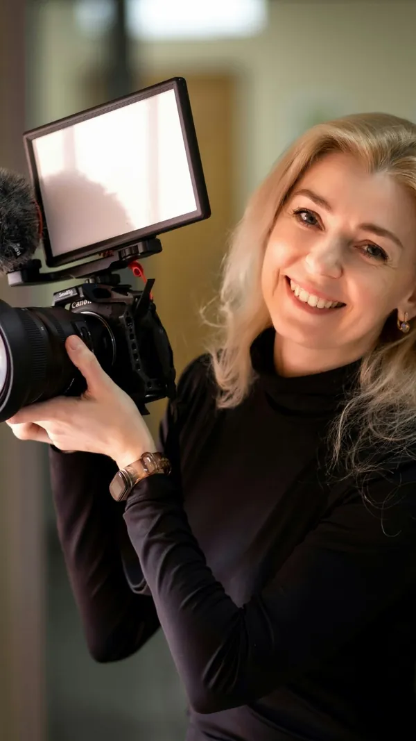 Videographer preparing a camera for content production